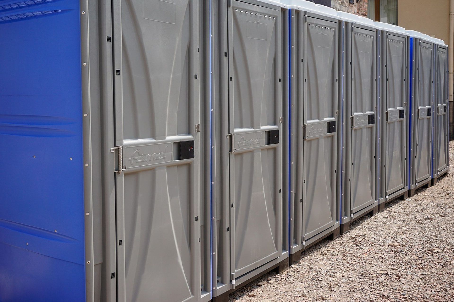 Portable Toilets with gray doors